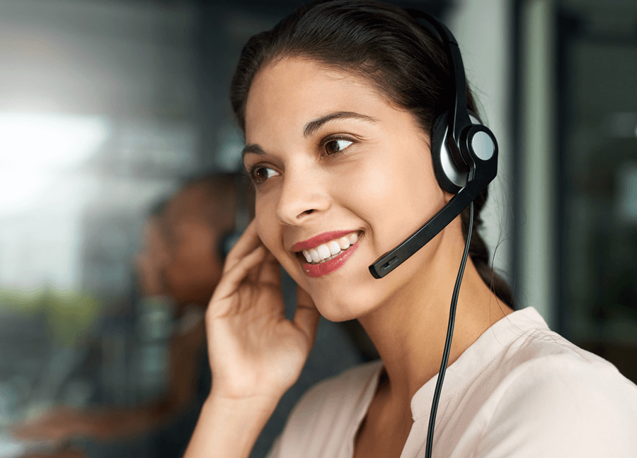 woman wearing a headset talking to a patient 