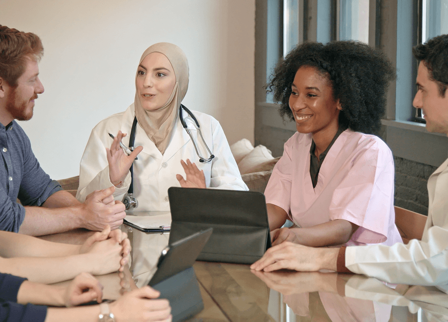 a group of physicians talking among themselves 