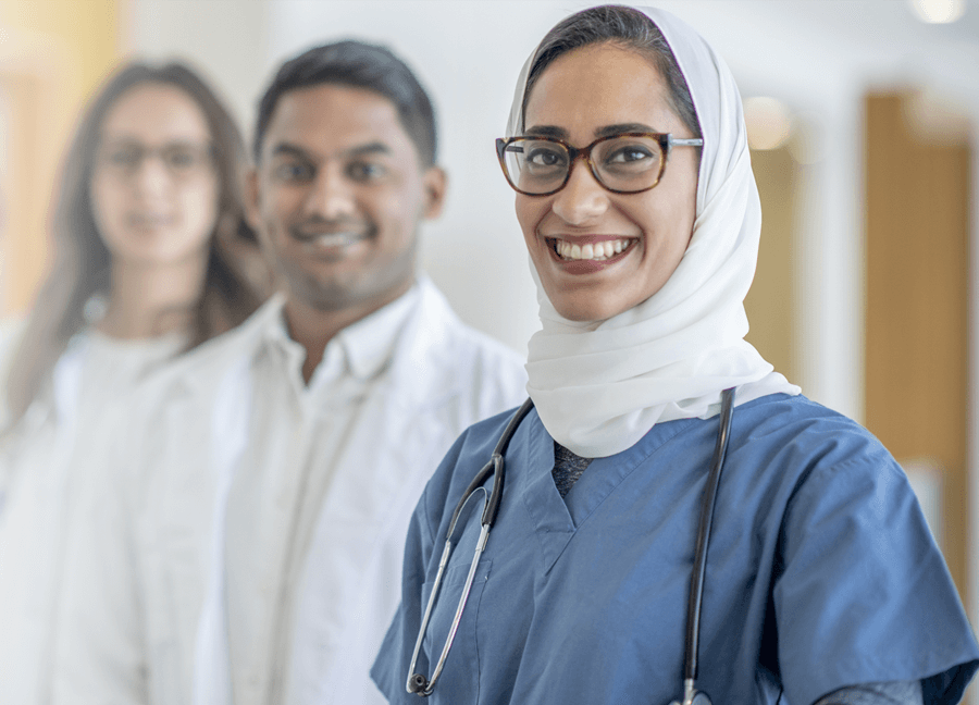 three doctors smiling 